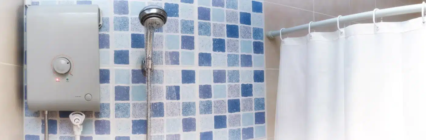 A wall-mounted instant shower heater in a Singapore bathroom. The controls, casing, and placement all affect how safely your family showers every day.